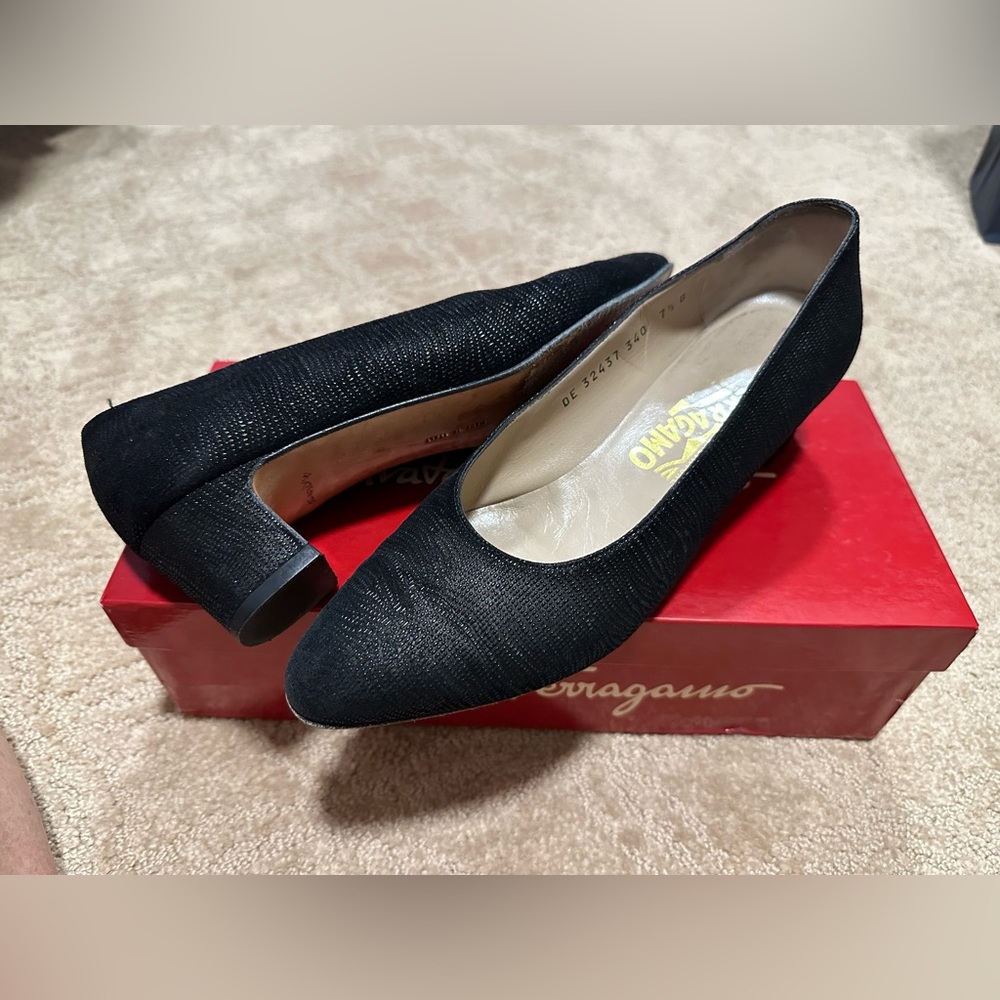 Black Ferragamo heels, gently warn